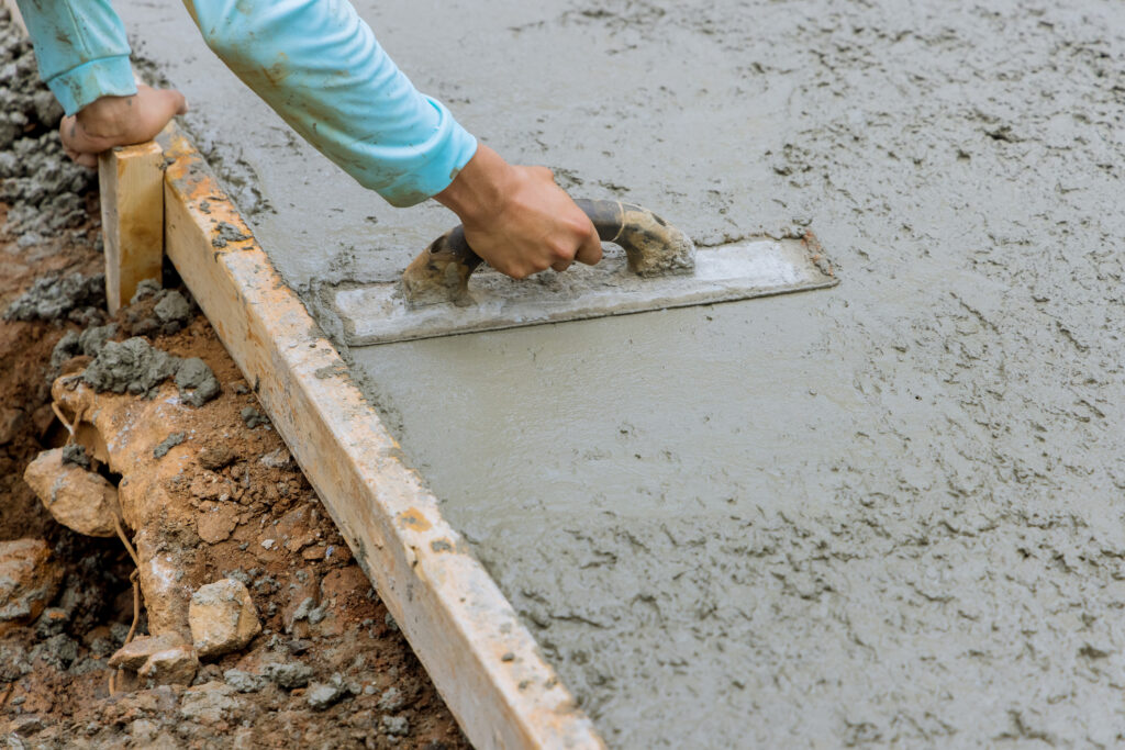 Leveling out a freshly poured concrete basketball court